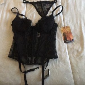 Black lace corset with gel inserts and garters.
